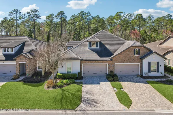 a view of a swimming pool and a yard