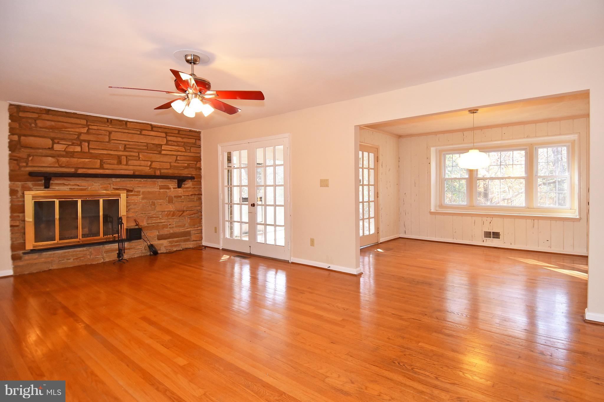 14911 West Auburn Road Accokeek, MD 20607 - Photo 11 of 30 a view of a livingroom with wooden floor and a ceiling fan