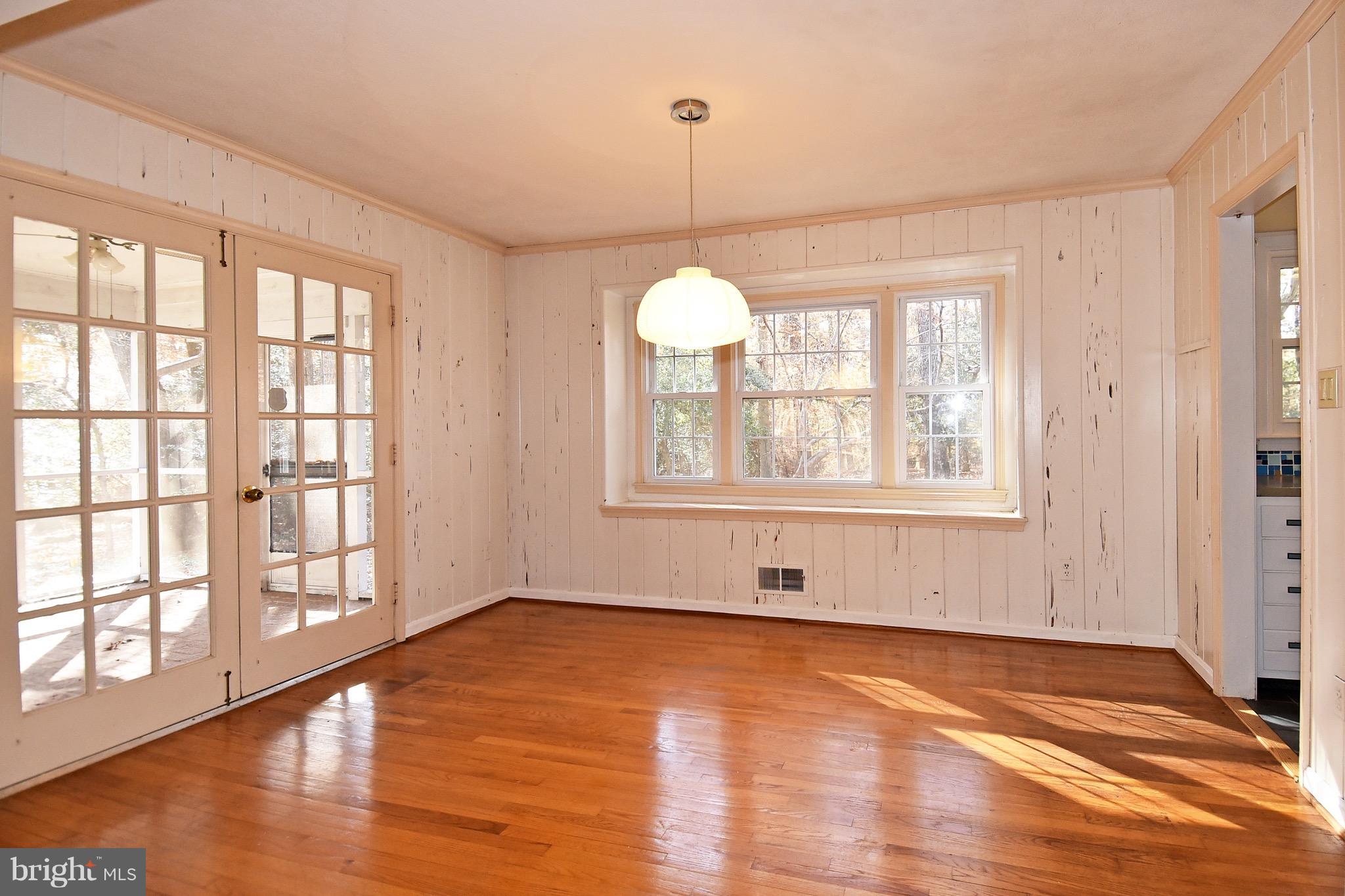14911 West Auburn Road Accokeek, MD 20607 - Photo 12 of 30 a view of an empty room with wooden floor and a window