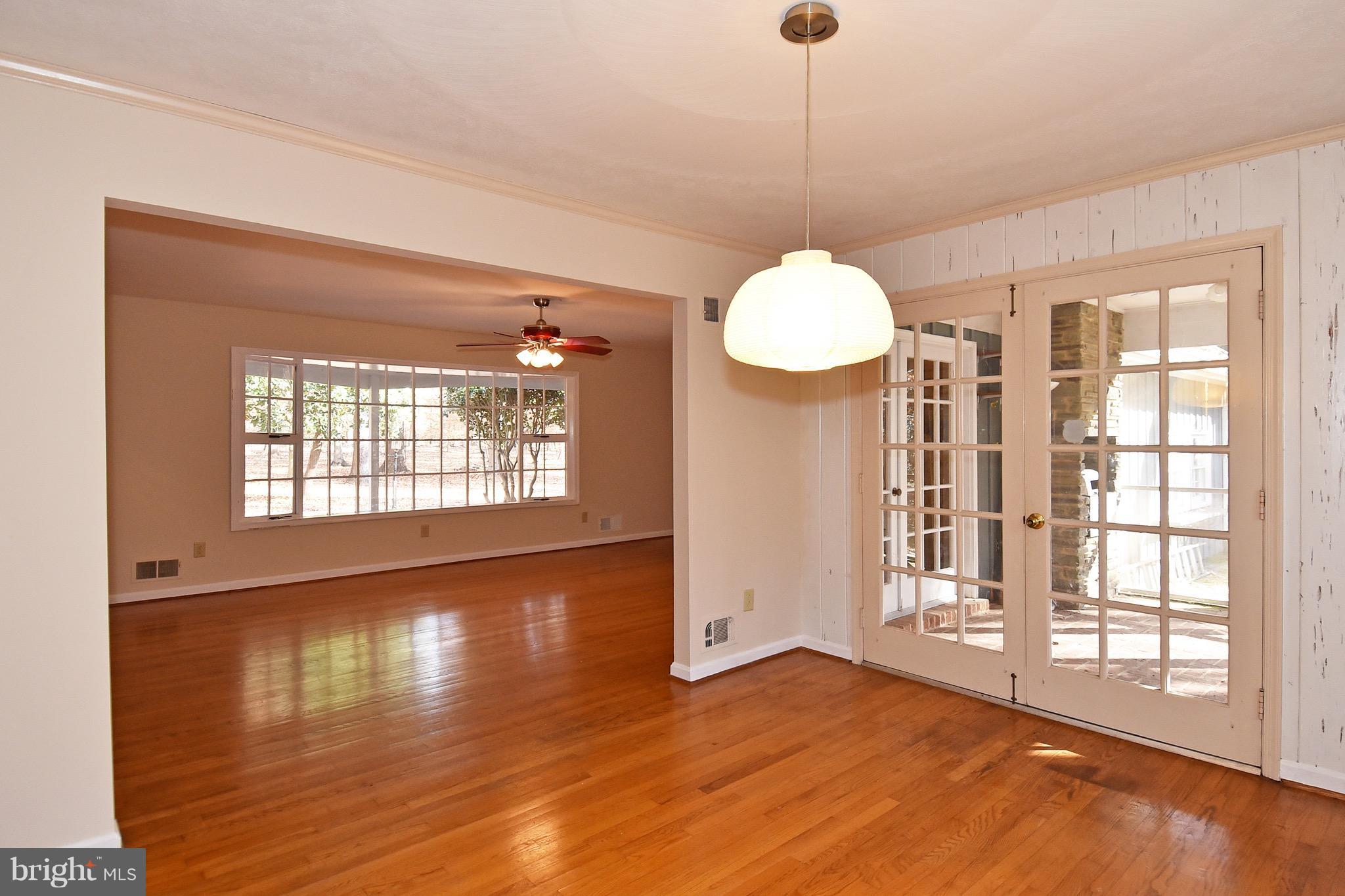 14911 West Auburn Road Accokeek, MD 20607 - Photo 13 of 30 a view of an empty room with wooden floor and a window