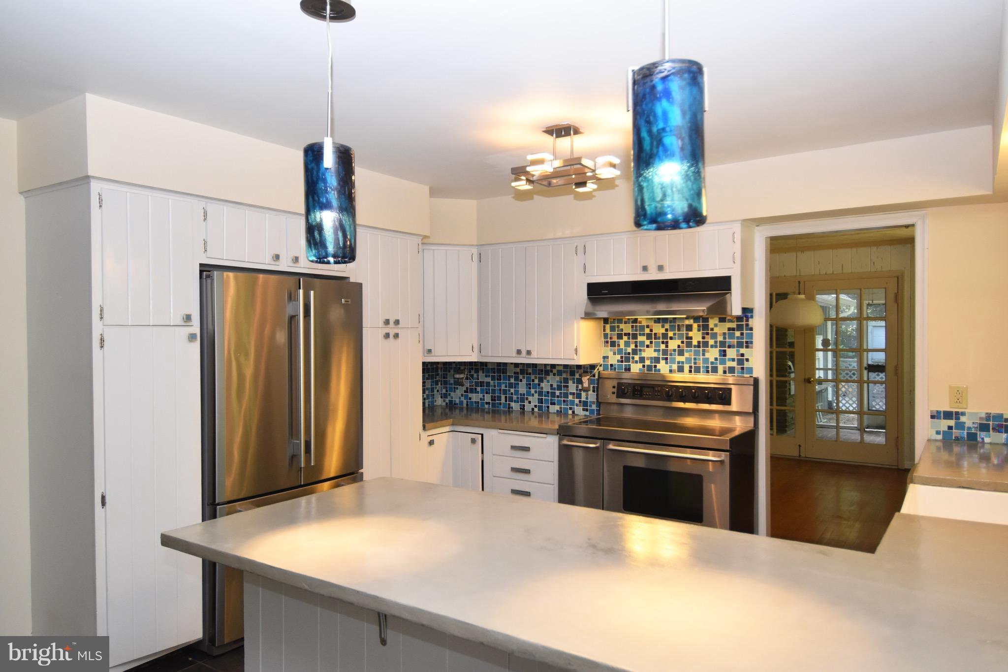 14911 West Auburn Road Accokeek, MD 20607 - Photo 14 of 30 a kitchen with stainless steel appliances a stove and refrigerator