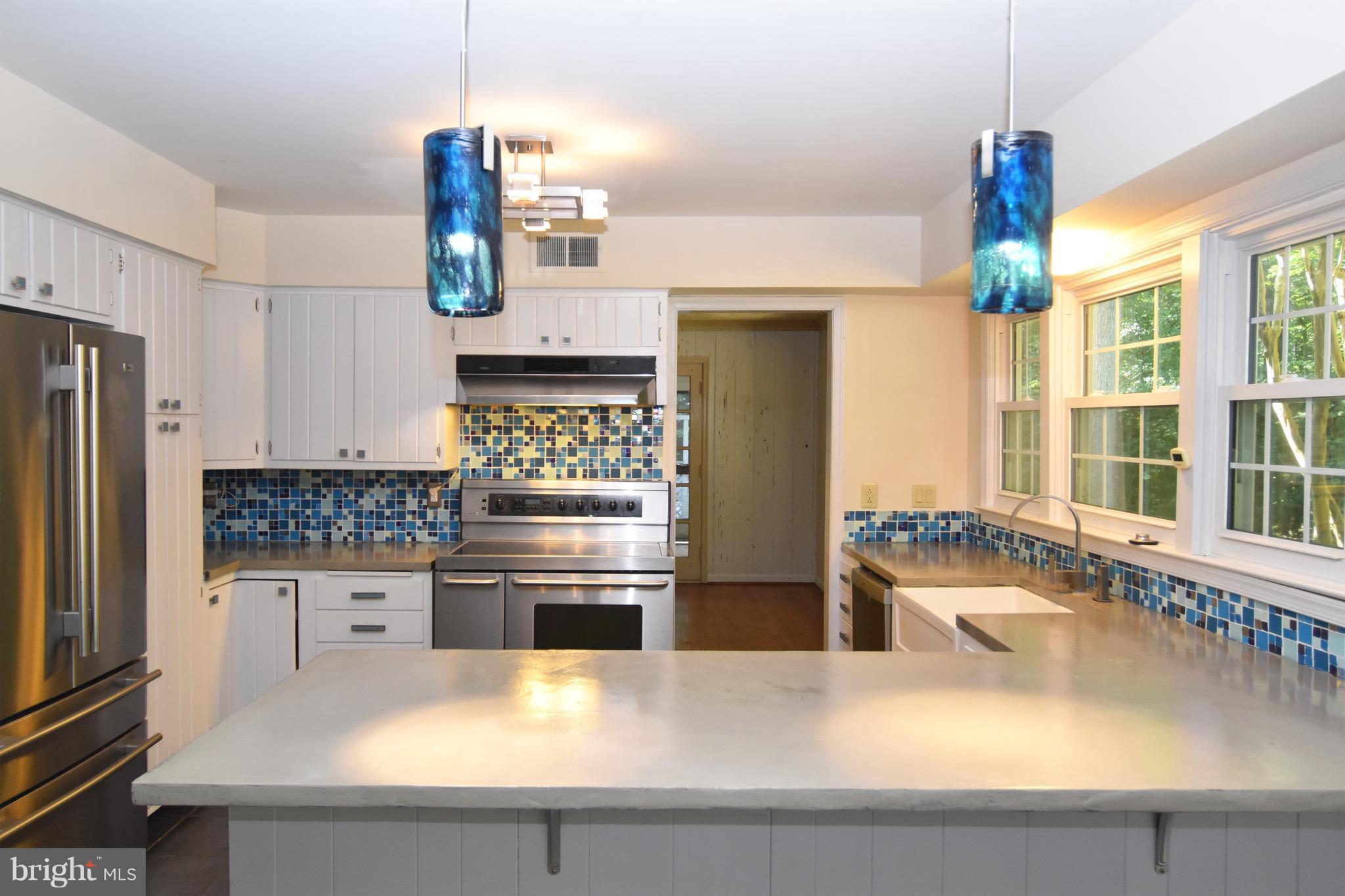 14911 West Auburn Road Accokeek, MD 20607 - Photo 15 of 30 a kitchen with stainless steel appliances a sink a stove and a refrigerator