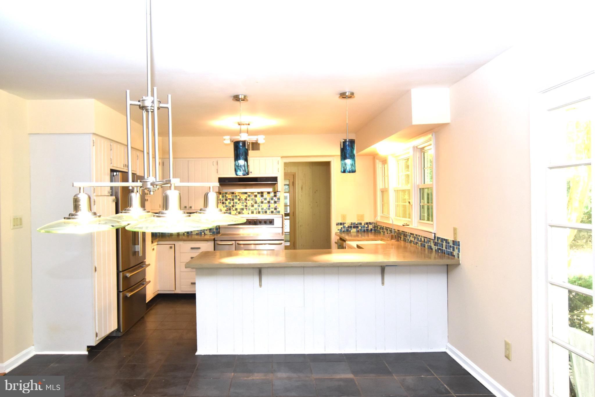 14911 West Auburn Road Accokeek, MD 20607 - Photo 16 of 30 a view of kitchen island with stainless steel appliances