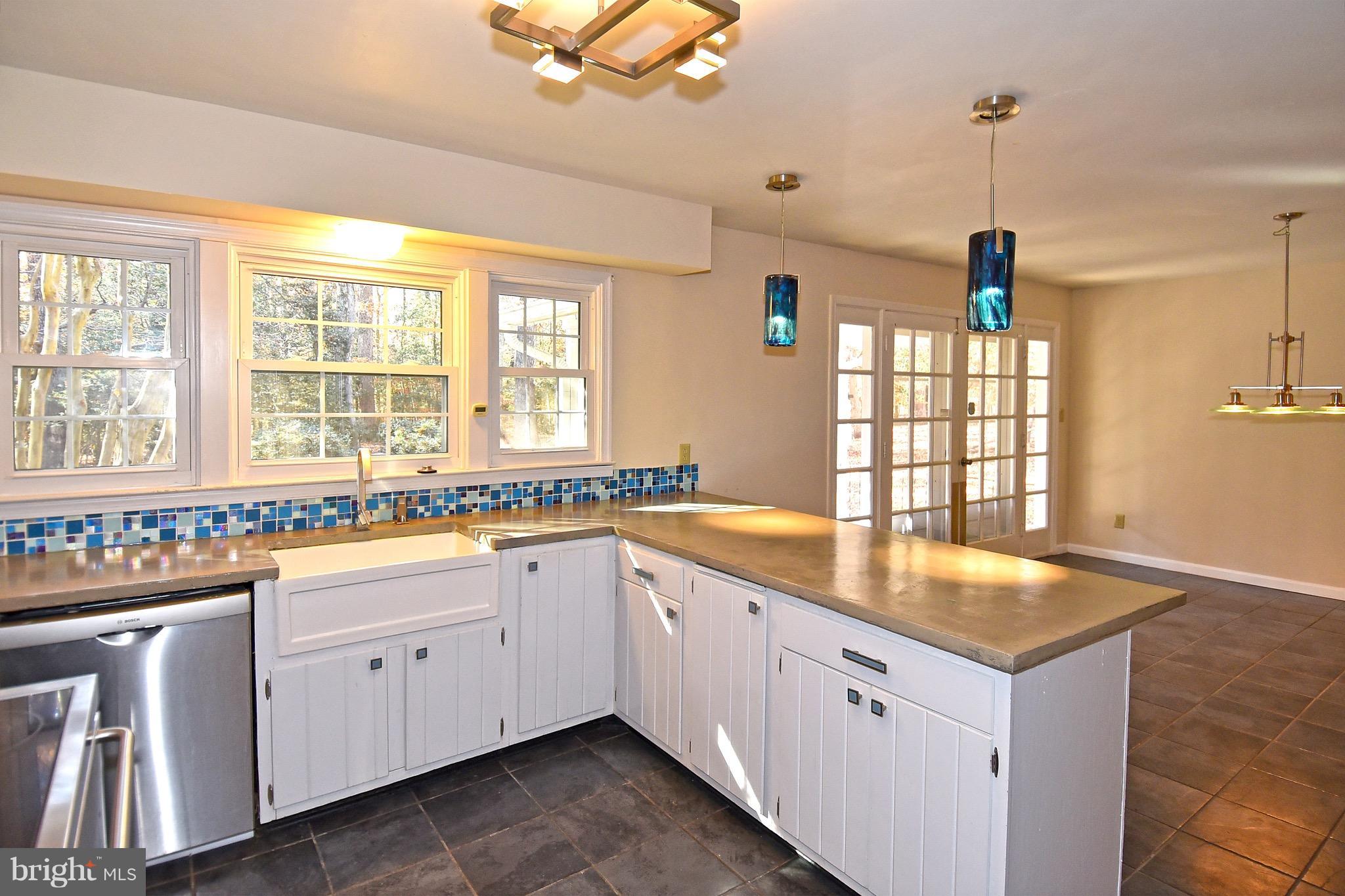 14911 West Auburn Road Accokeek, MD 20607 - Photo 17 of 30 a kitchen with granite countertop white cabinets and white appliances