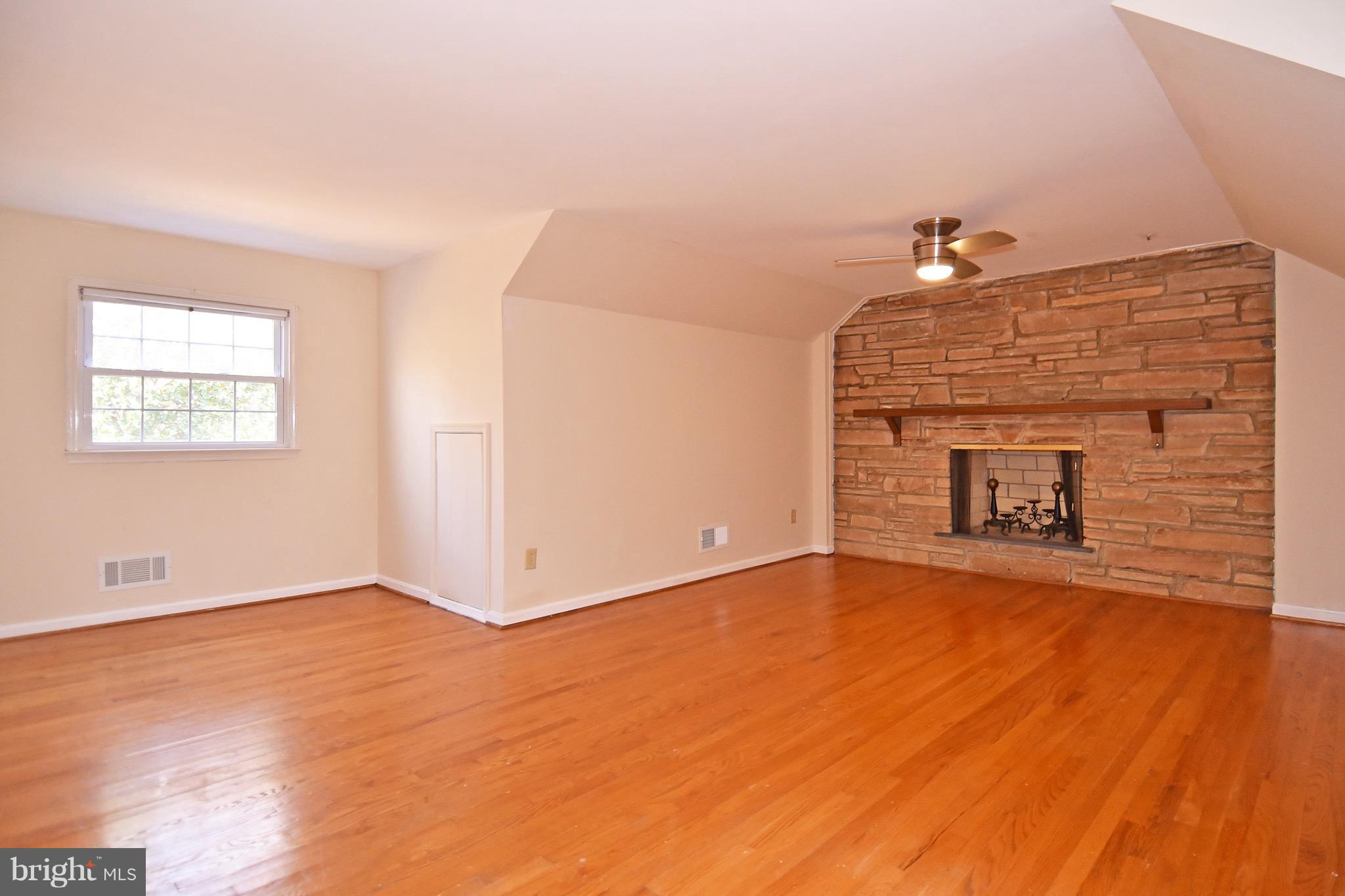 14911 West Auburn Road Accokeek, MD 20607 - Photo 21 of 30 a view of an empty room with a window and wooden floor
