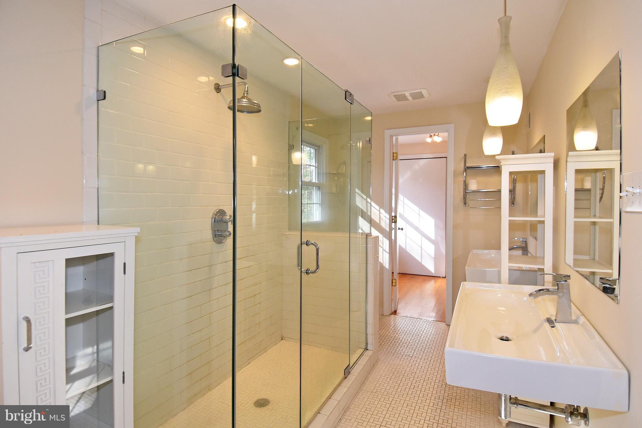 14911 West Auburn Road Accokeek, MD 20607 - Photo 23 of 30 a bathroom with a tub shower and sink