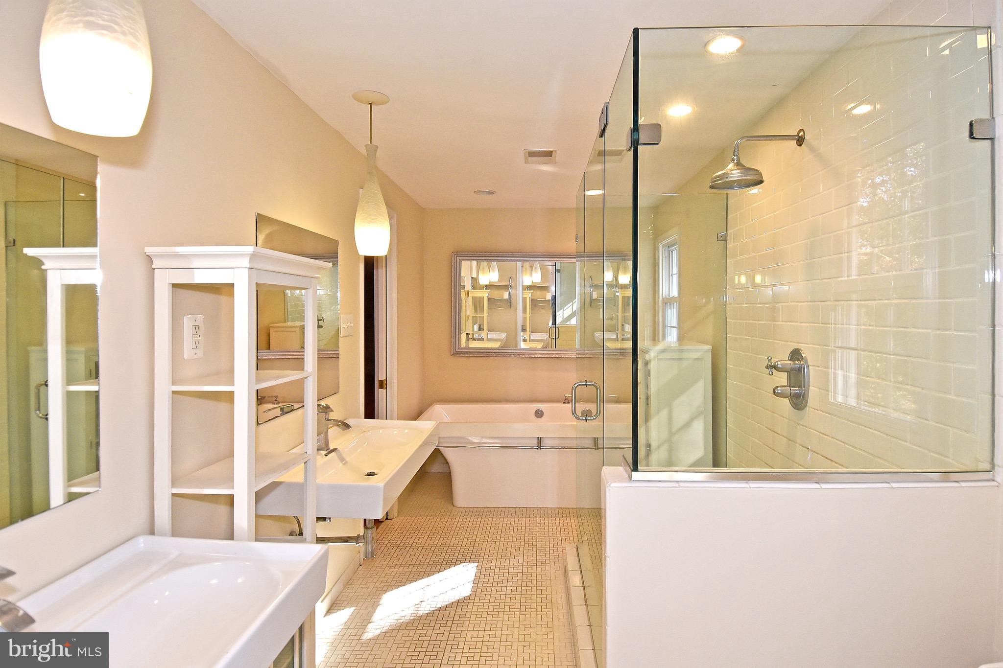 14911 West Auburn Road Accokeek, MD 20607 - Photo 24 of 30 a spacious bathroom with a tub shower and sink
