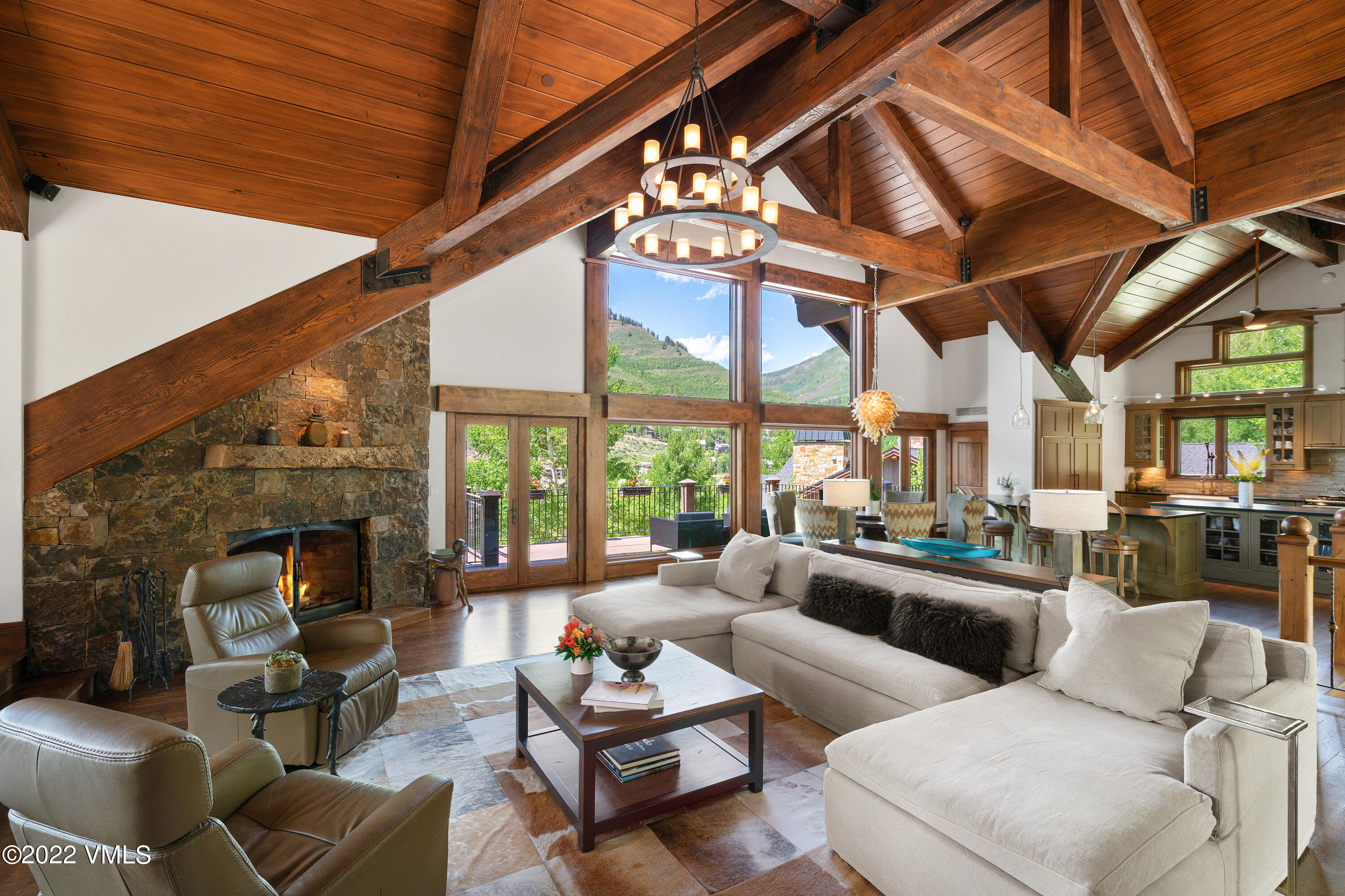 1250 Westhaven Circle Vail, CO 81657 - Photo 8 of 53 a living room with furniture a fireplace and a large window