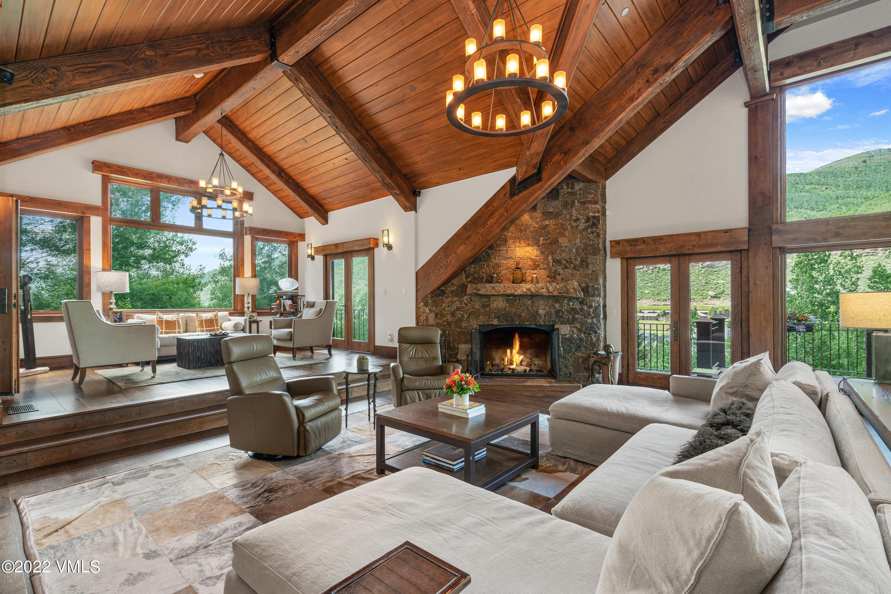 1250 Westhaven Circle Vail, CO 81657 - Photo 9 of 53 a living room with furniture a fireplace and a large window