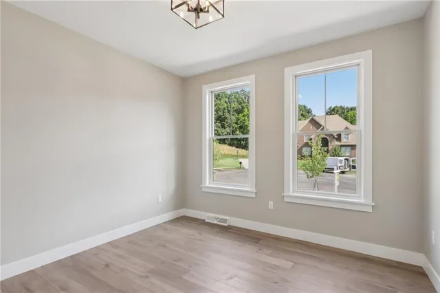 an empty room with windows and a window