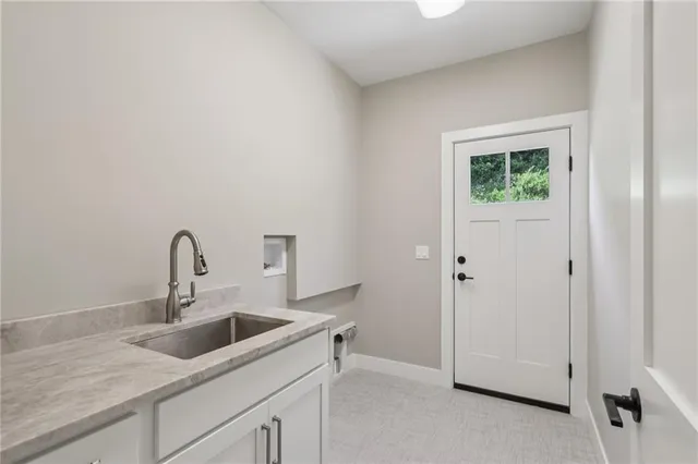 a kitchen with a sink and a vanity
