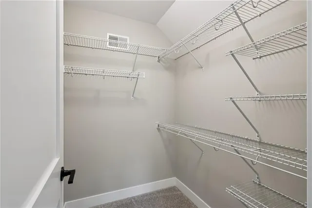 a bathroom with a double vanity sink mirror and toilet