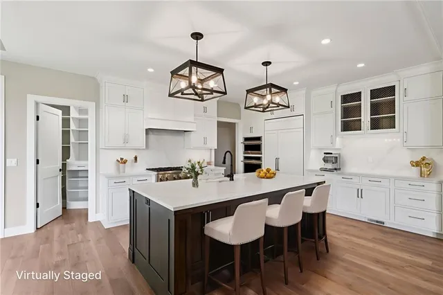 a kitchen with a dining table and chairs