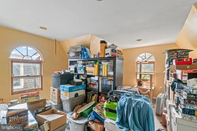 a living room with lots of furniture and a window