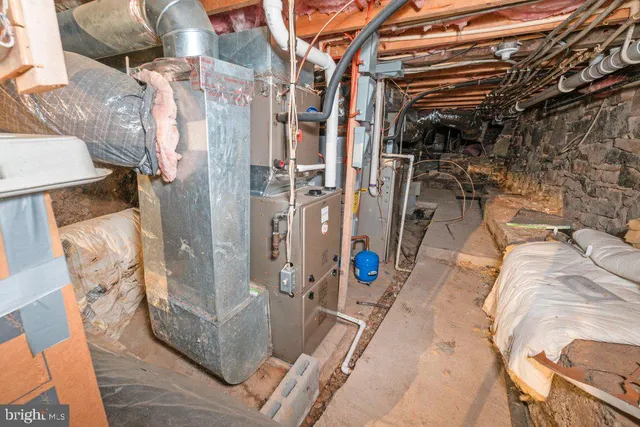 a view of a pathway of house with wooden fence