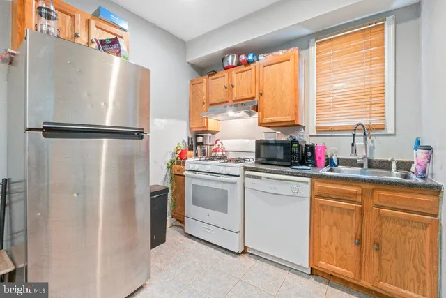 a refrigerator freezer sitting inside of a kitchen