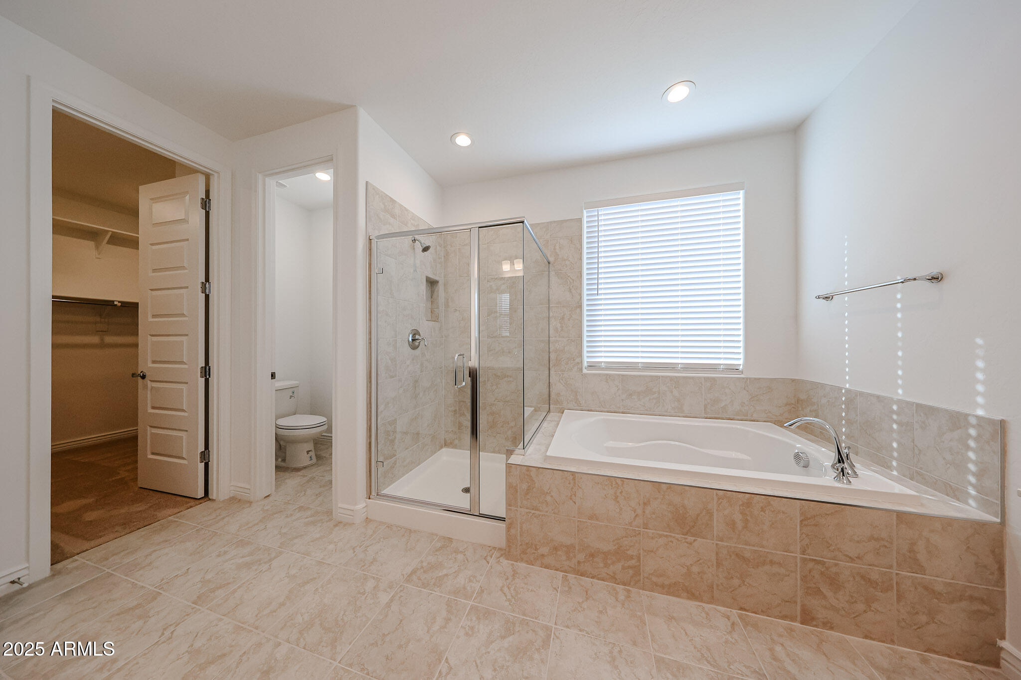 25128 North 171st Avenue Surprise, AZ 85387 - Photo 12 of 22 a spacious bathroom with a tub shower and sink