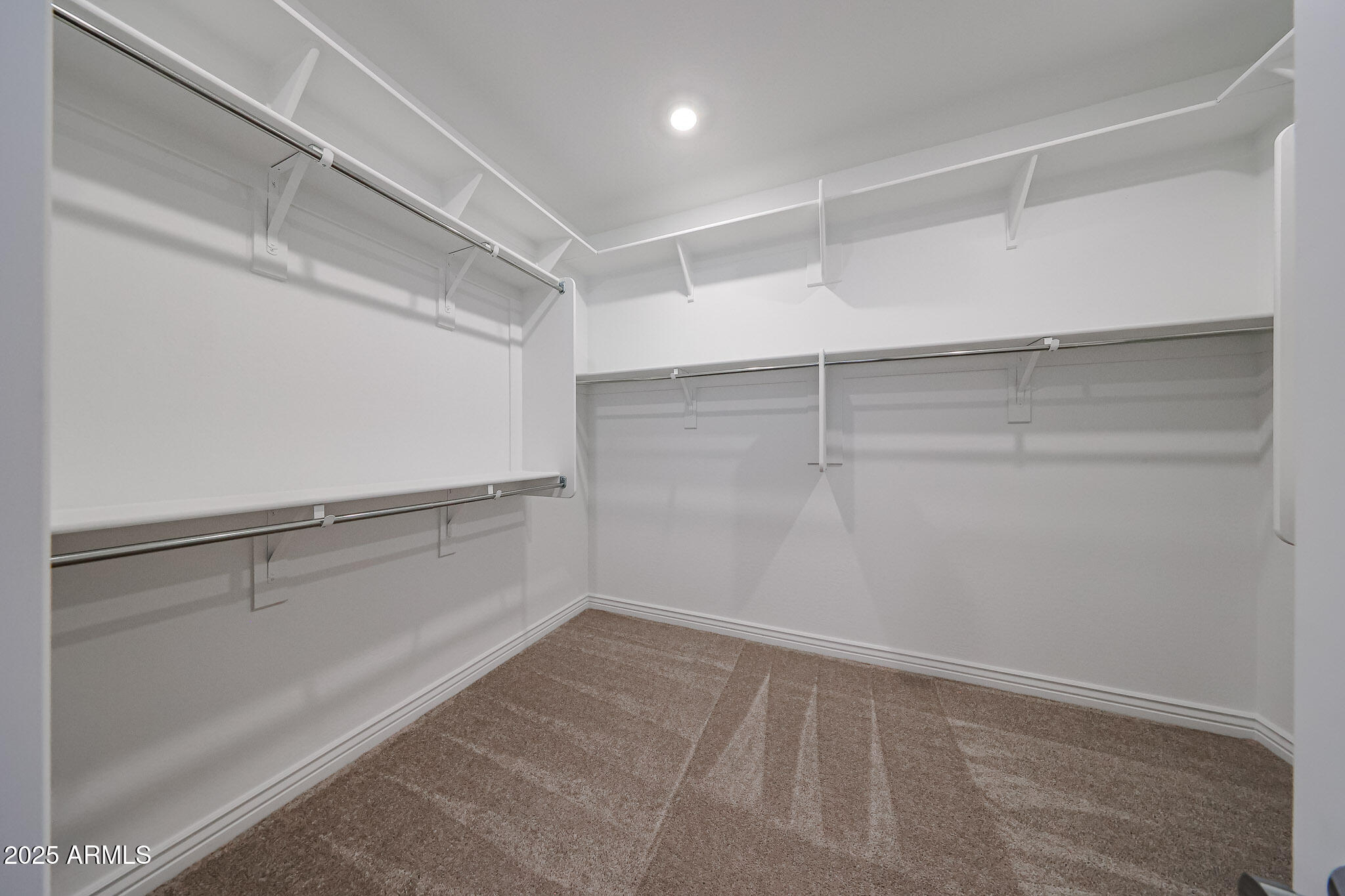 25128 North 171st Avenue Surprise, AZ 85387 - Photo 13 of 22 a view of a room with racks on the wall