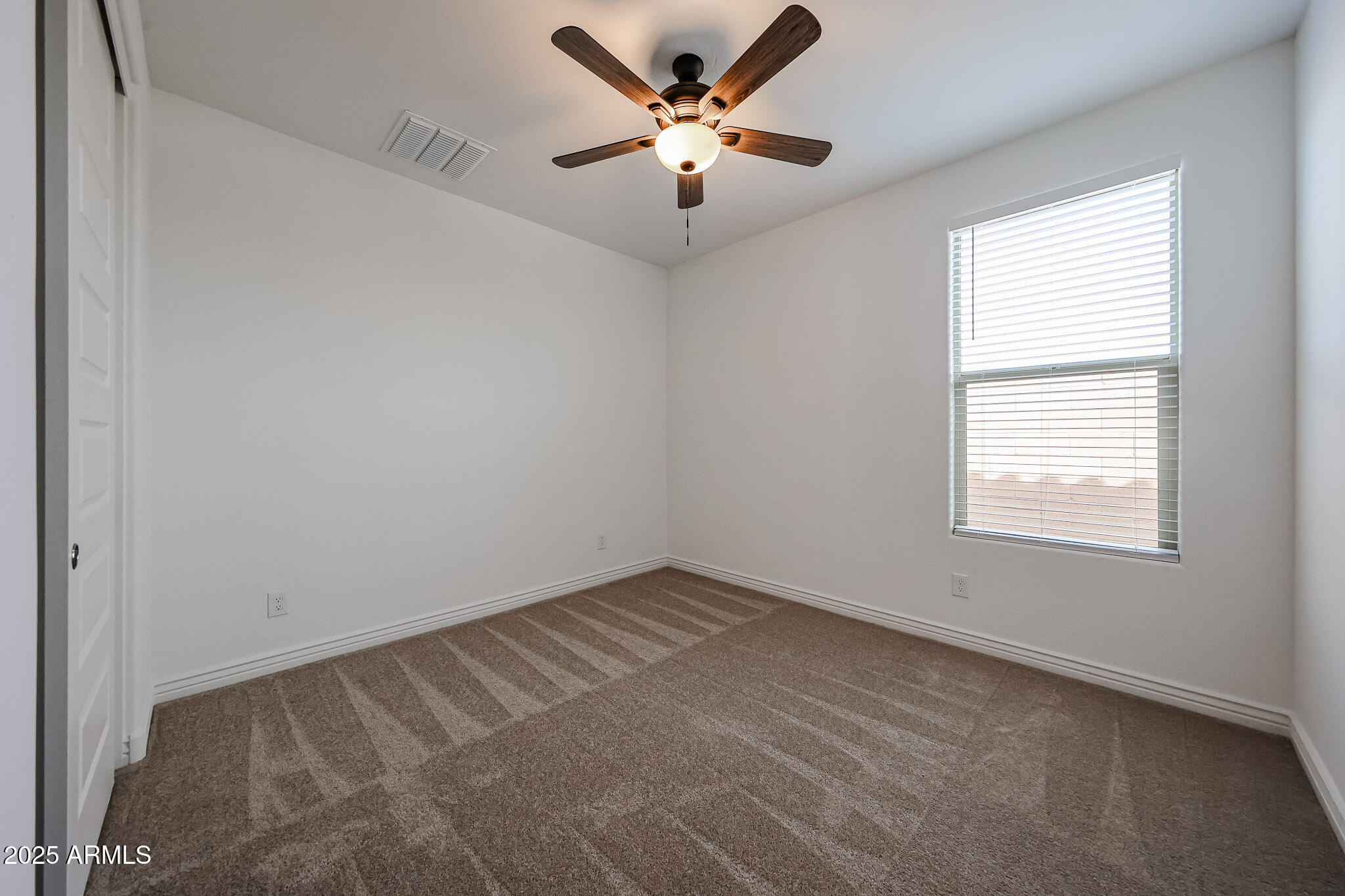 25128 North 171st Avenue Surprise, AZ 85387 - Photo 14 of 22 a view of an empty room with a window
