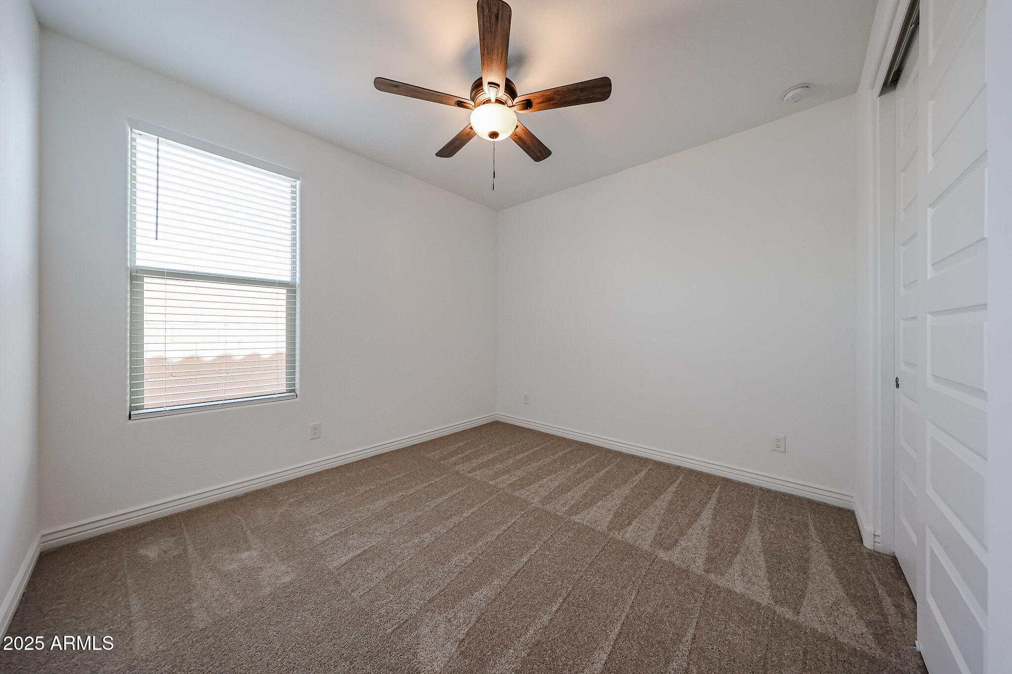 25128 North 171st Avenue Surprise, AZ 85387 - Photo 15 of 22 an empty room with a window