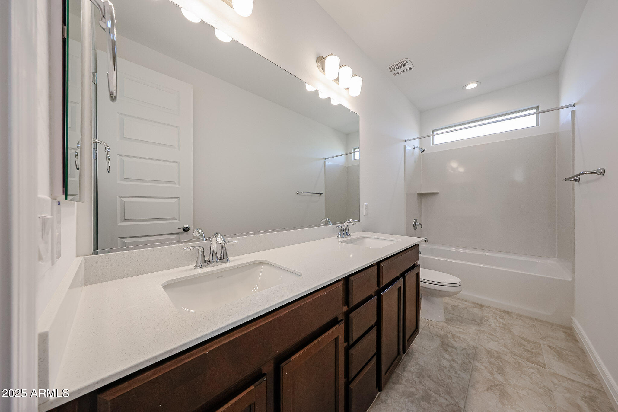 25128 North 171st Avenue Surprise, AZ 85387 - Photo 16 of 22 a bathroom with a sink double vanity granite tub and a mirror