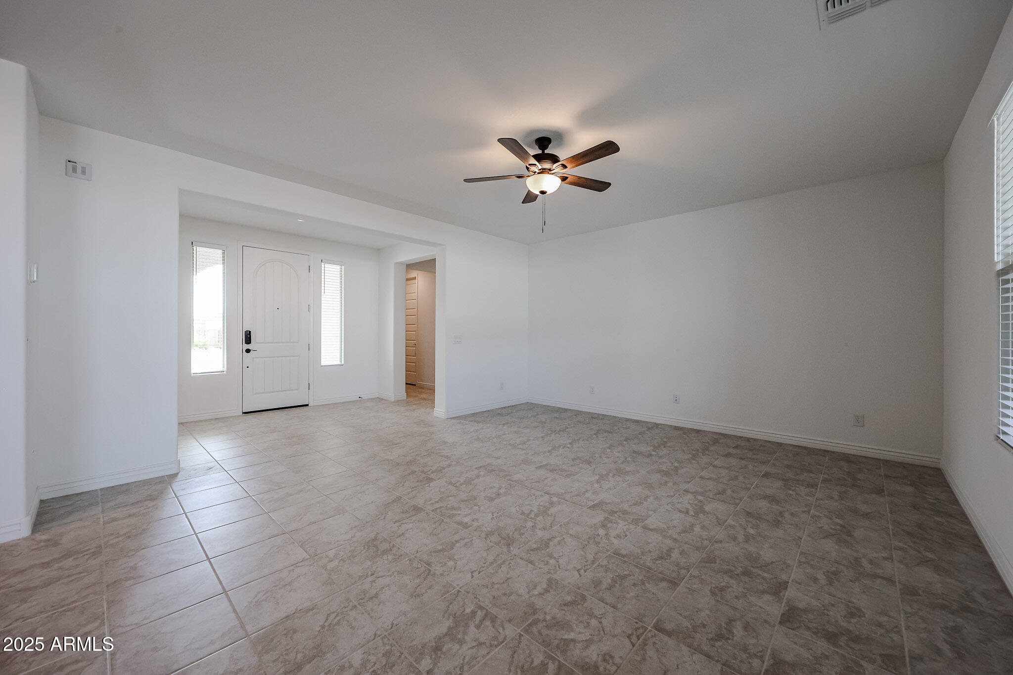 25128 North 171st Avenue Surprise, AZ 85387 - Photo 7 of 22 a view of an empty room with a window