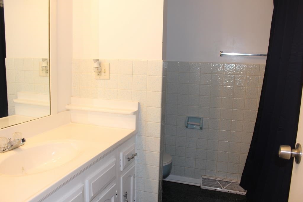 2870 Karr Road Belvidere, IL 61008 - Photo 11 of 22 a bathroom with a shower and a sink