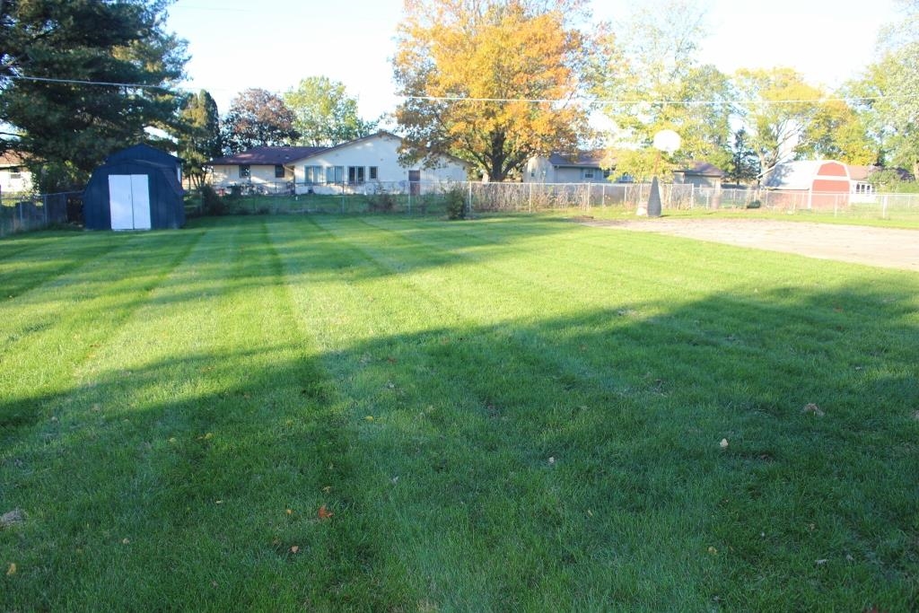 2870 Karr Road Belvidere, IL 61008 - Photo 17 of 22 a view of yard with swimming pool and green space
