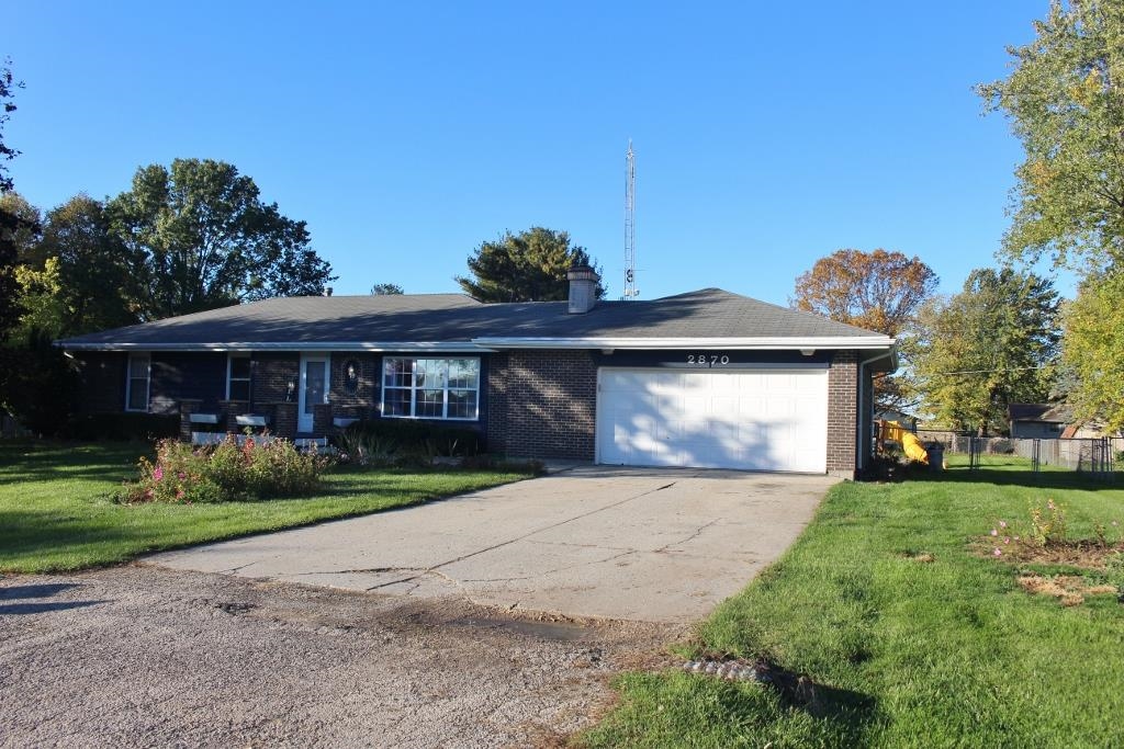 2870 Karr Road Belvidere, IL 61008 - Photo 21 of 22 a front view of a house with a yard and garage