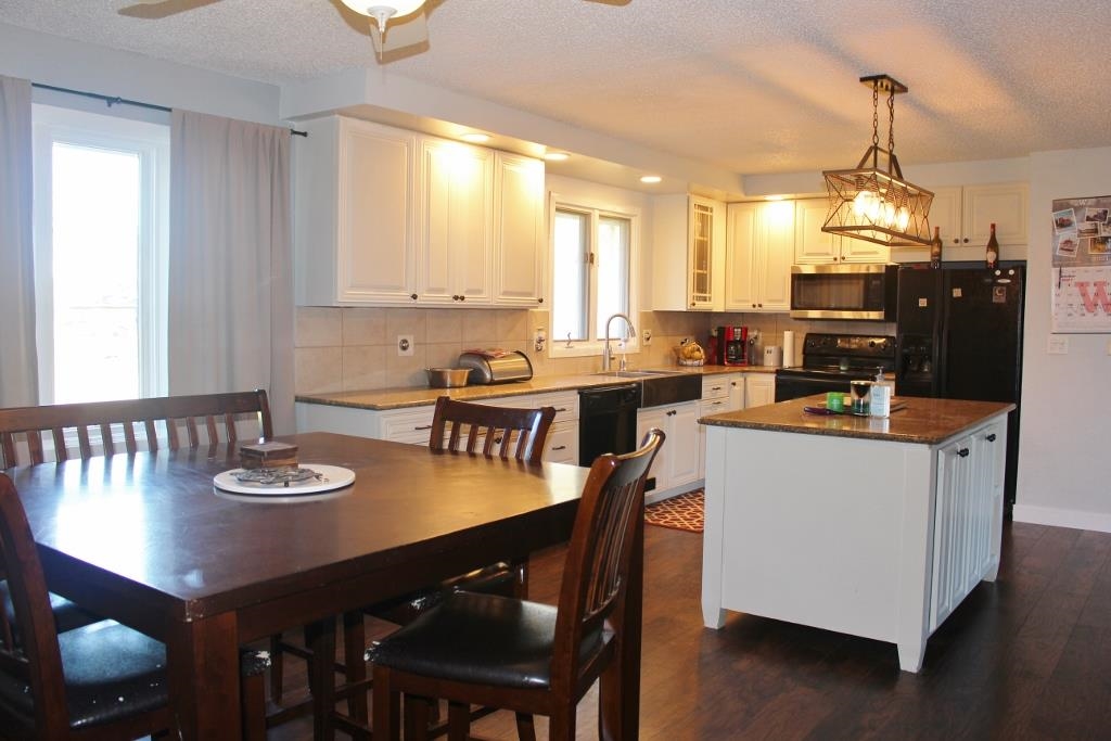 2870 Karr Road Belvidere, IL 61008 - Photo 4 of 22 a kitchen with a dining table chairs and window