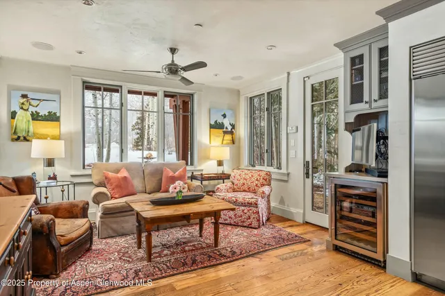 a dining room with furniture and wooden floor