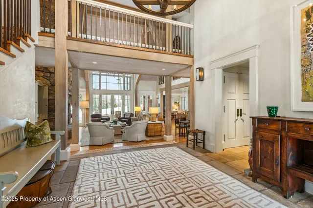 a bathroom with a granite countertop tub and a window