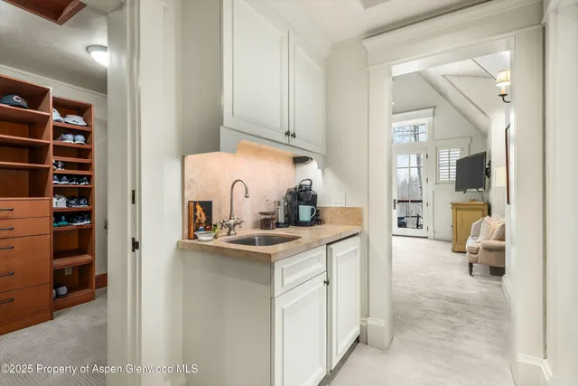 a bathroom with a tub a sink and a shower