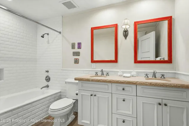 a bathroom with a sink and mirror