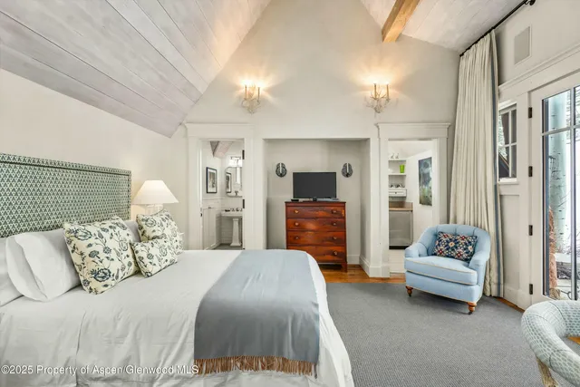 a view of a house with snow on the road