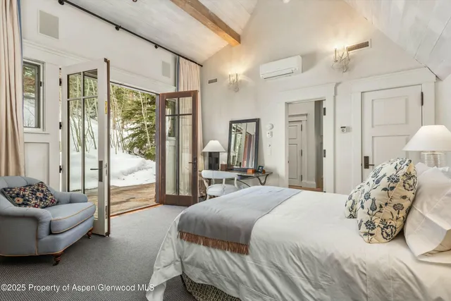 a patio with patio couch and a dining table with balcony view