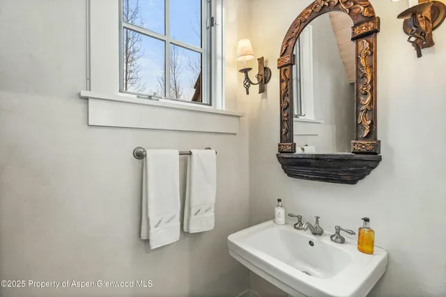 a utility room with sink dryer and washer