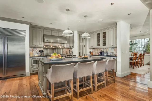 a kitchen with stainless steel appliances granite countertop a stove and a sink