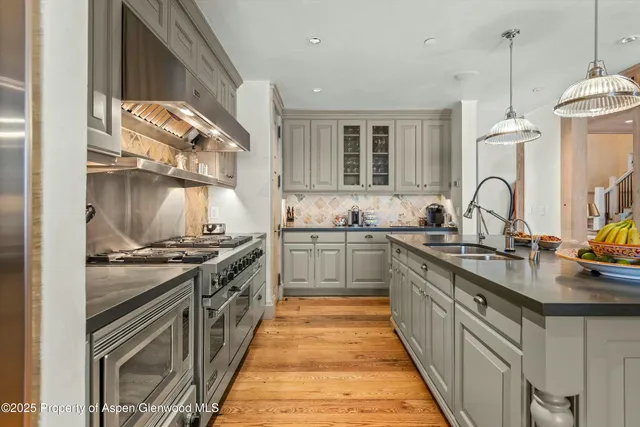 a kitchen with counter top space and stainless steel appliances