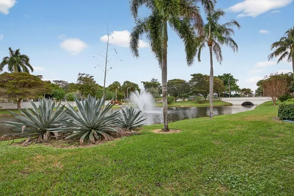 a view of a glass door with a tv from a window