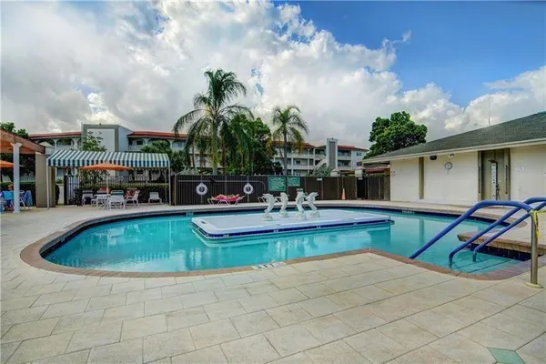 a view of a swimming pool and a patio