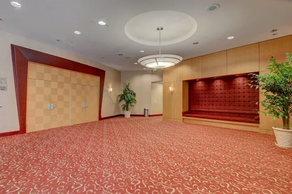 a view of a workspace with furniture and wooden floor