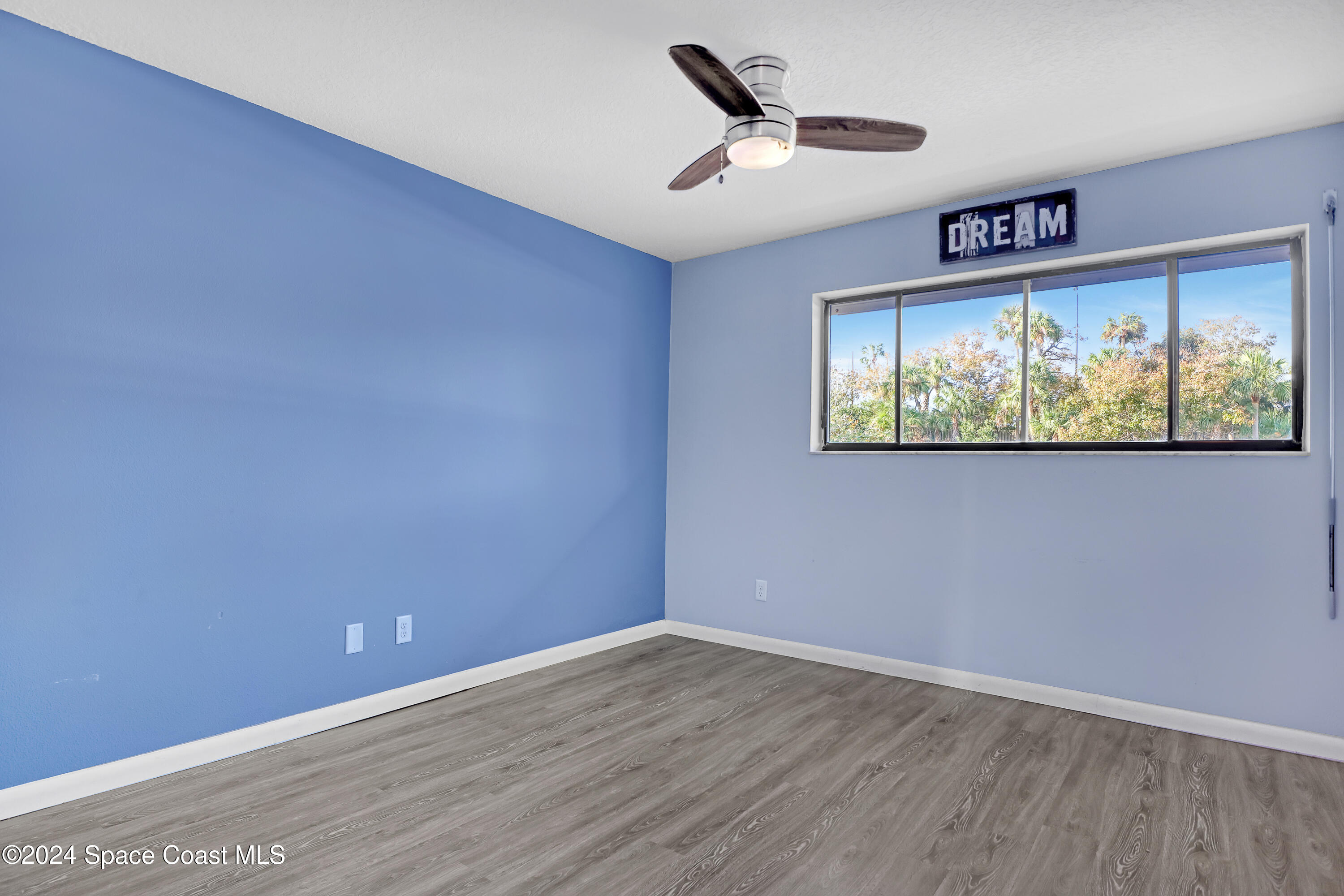 3901 Dixie Highway Northeast, Unit 209 Palm Bay, FL 32905 - Photo 18 of 49 an empty room with windows