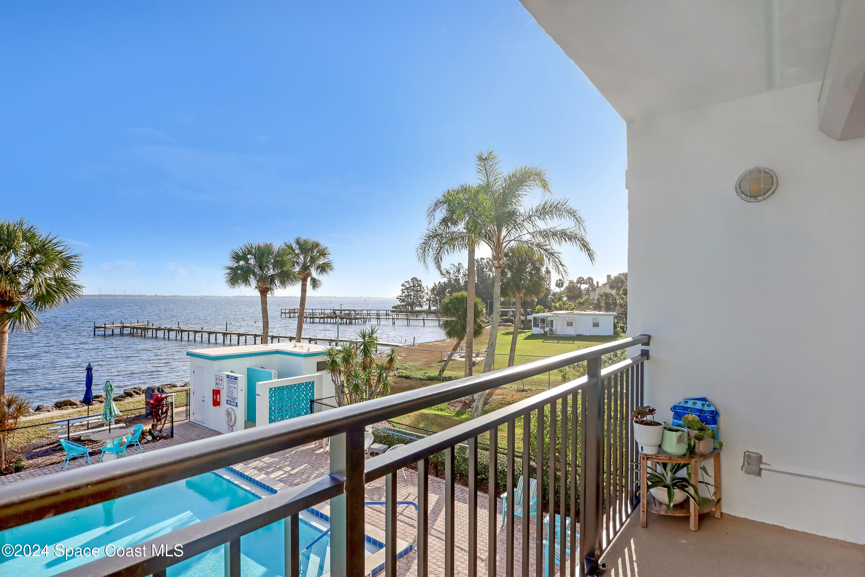 3901 Dixie Highway Northeast, Unit 209 Palm Bay, FL 32905 - Photo 22 of 49 a view of a balcony with many windows