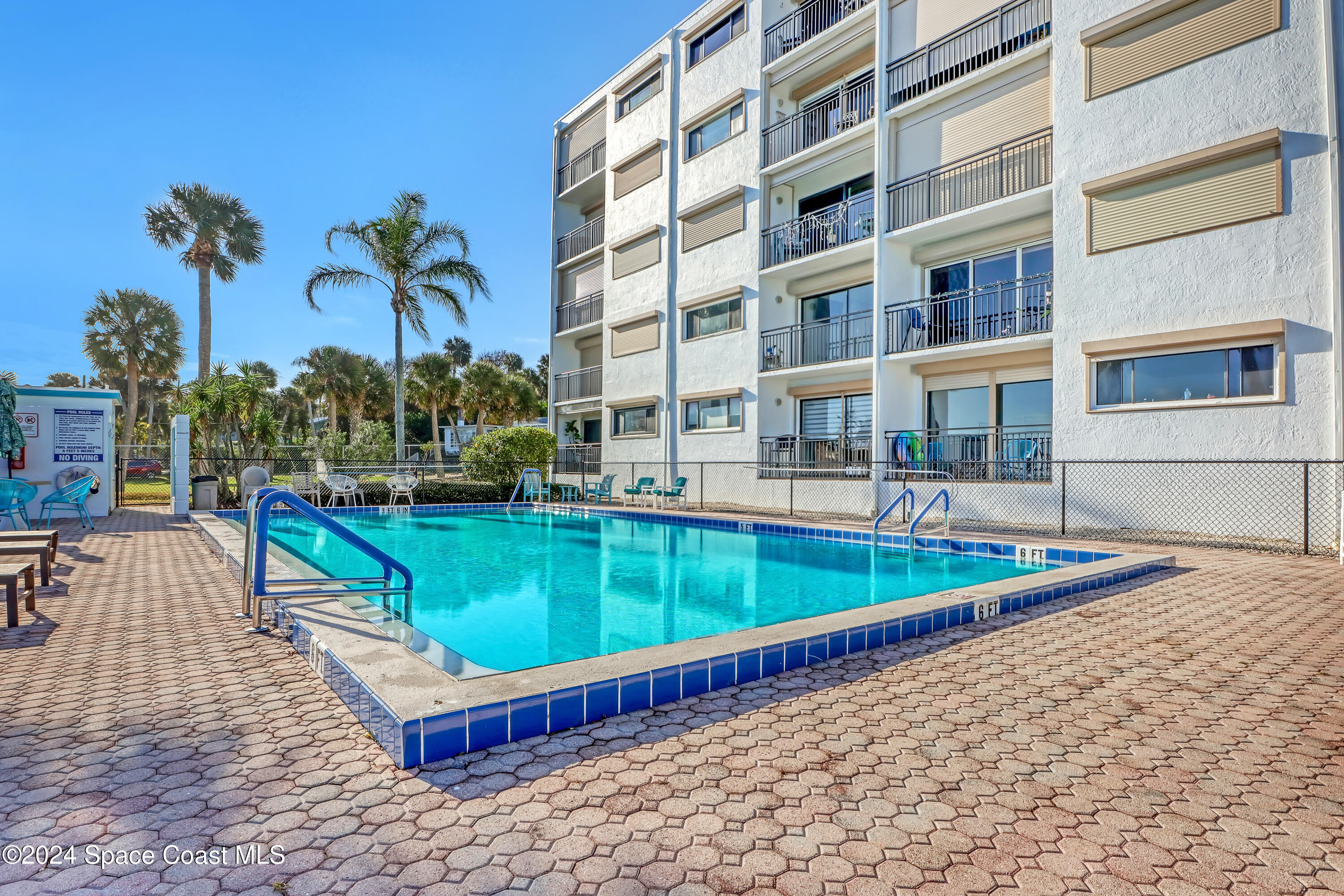 3901 Dixie Highway Northeast, Unit 209 Palm Bay, FL 32905 - Photo 40 of 49 a view of a swimming pool with a lounge chairs