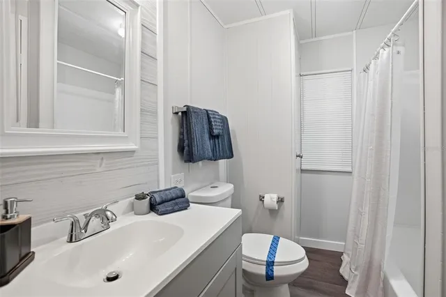 a kitchen with stainless steel appliances granite countertop a sink a stove and a microwave