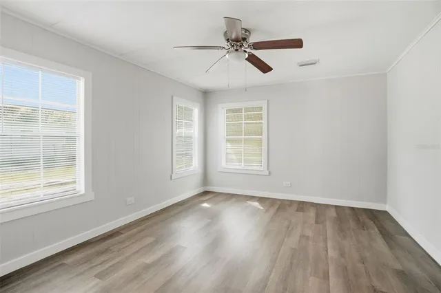 a bathroom with a toilet and a window