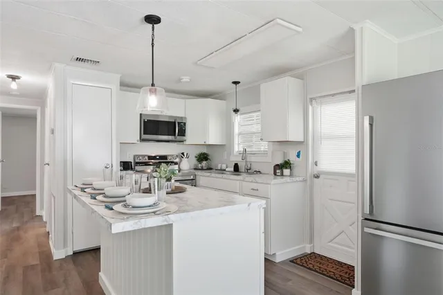 a room with washing machine and mirror