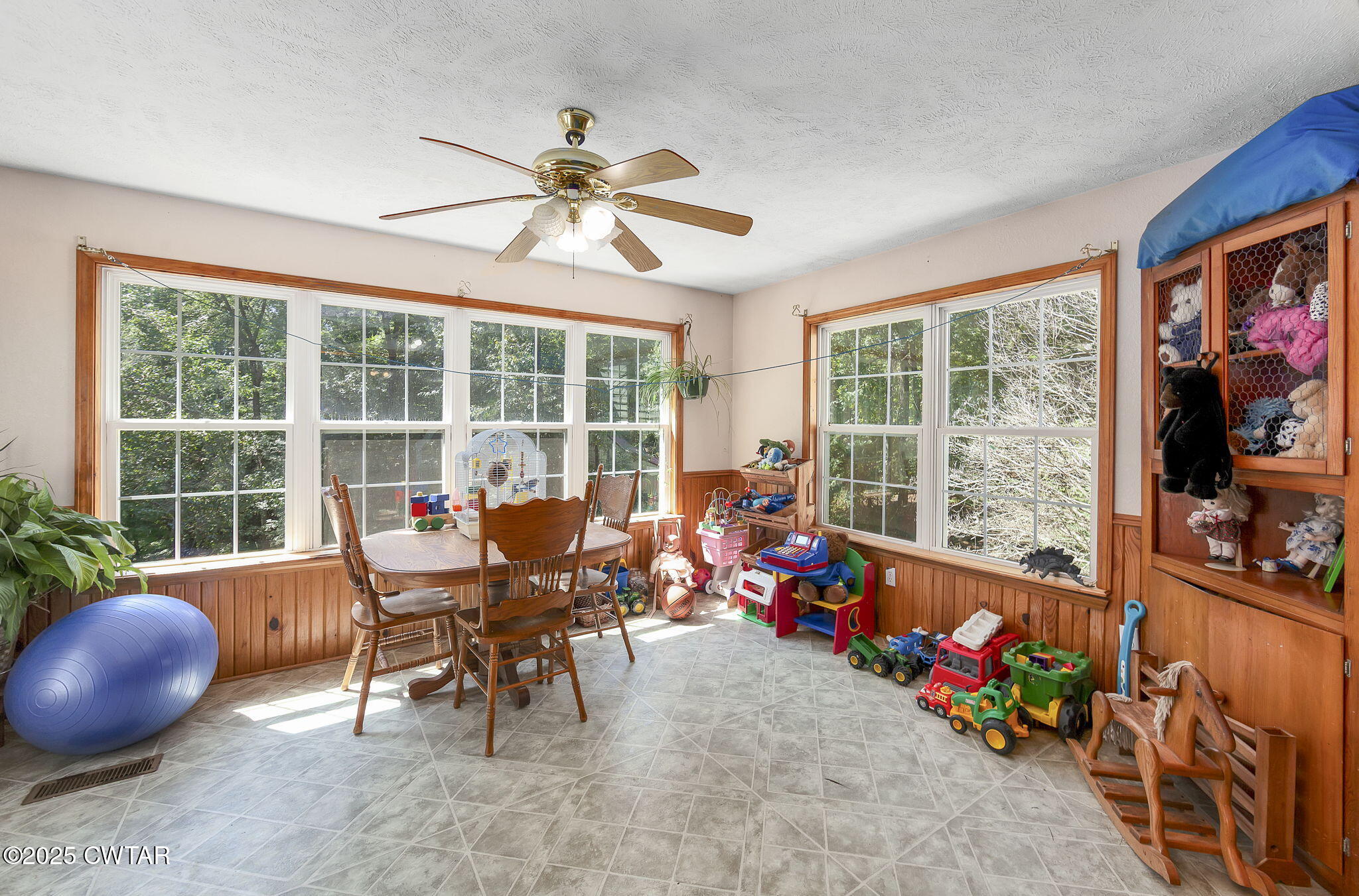 50 Braund Road Finger, TN 38334 - Photo 17 of 65 a dining room with furniture a flat screen tv and a floor to ceiling window