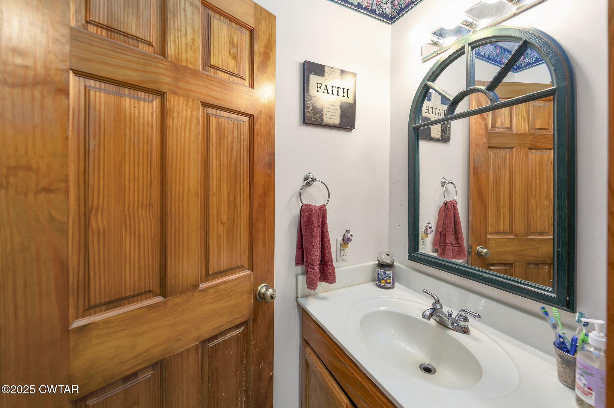 50 Braund Road Finger, TN 38334 - Photo 19 of 65 a bathroom with a sink a mirror a vanity and a shower